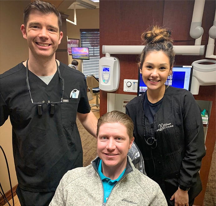 Services2_14-min dentist and assistant with a patient